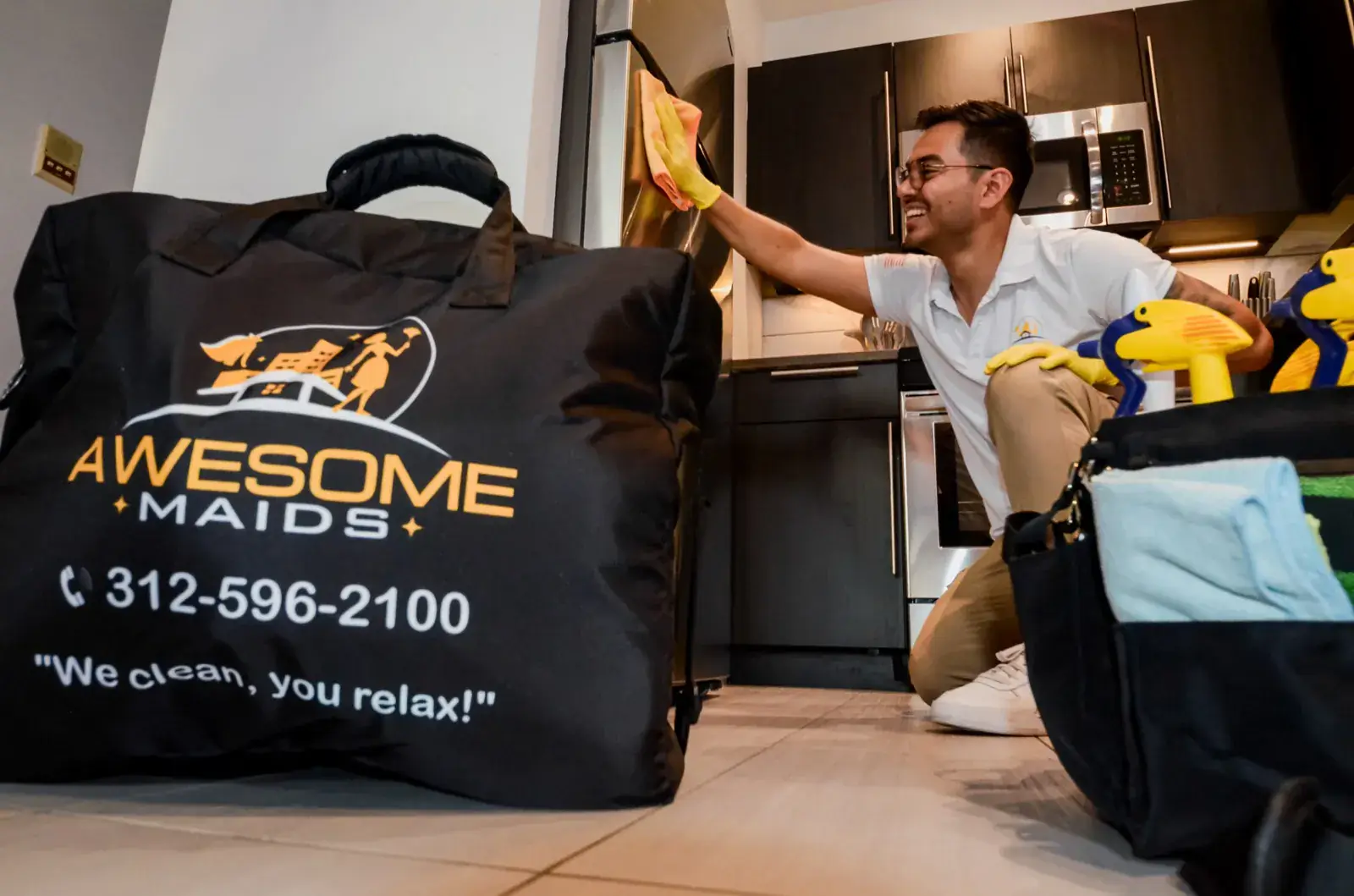 Awesome Cleaning supply bag with team member in a Chicago kitchen